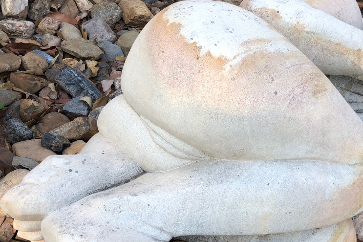 A sandstone sculpture outside an arts centre