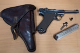 A 1915 WWI German Luger pistol  and holster surrendered in the firearms amnesty.