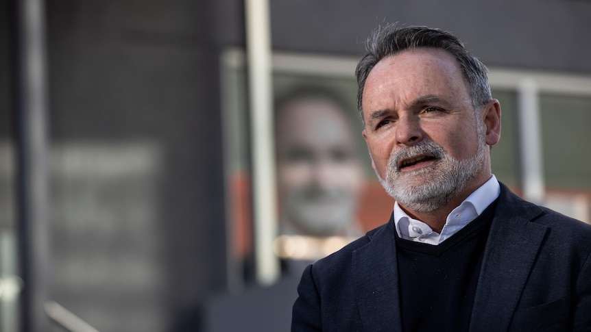 David O'Byrne speaks at a press conference.