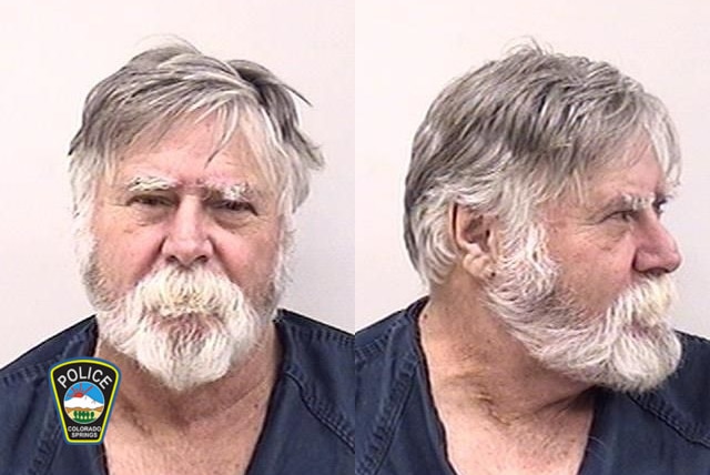 A mug shot of a man with a white beard