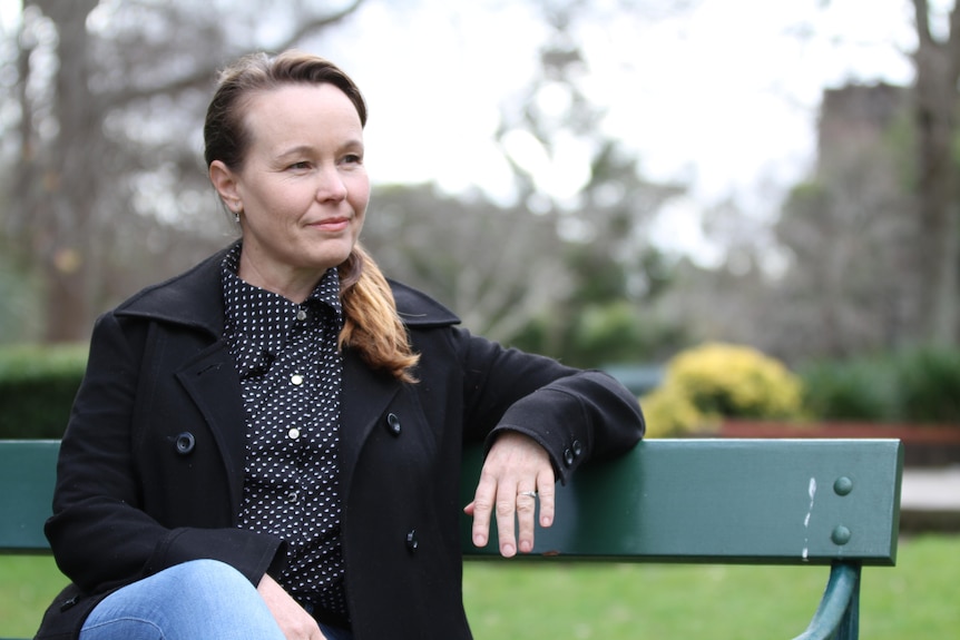 A woman on a park bench