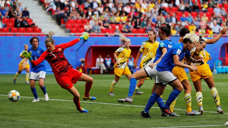 Australia's Lydia Williams watches as the ball goes past her.