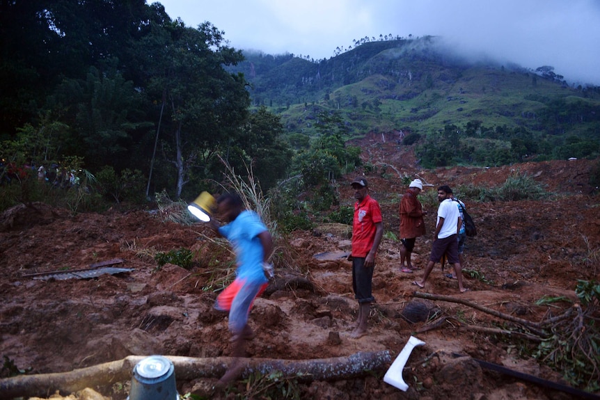 Mudslides triggered by monsoon rains sweep through a tea-growing region of Sri Lanka