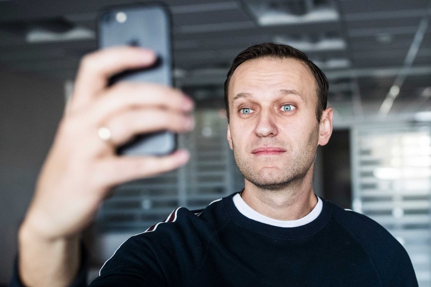 Russian opposition leader Alexei Navalny takes a selfie