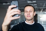 Russian opposition leader Alexei Navalny takes a selfie