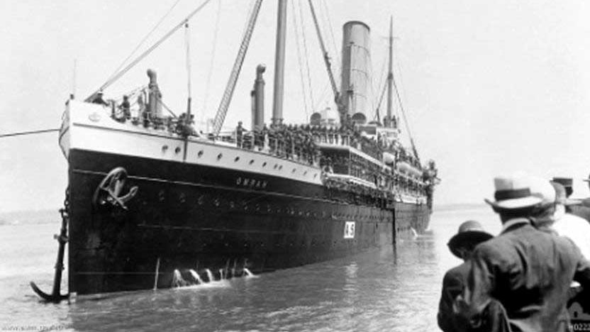 A troop transport ship departs from Brisbane during World War I.