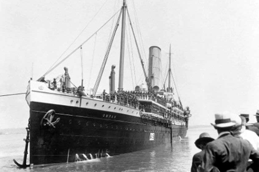 A troop transport ship departs from Brisbane during World War I.