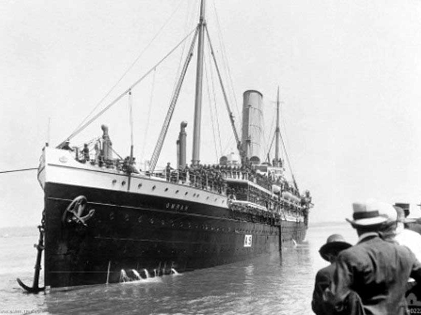 A troop transport ship departs from Brisbane during World War I.