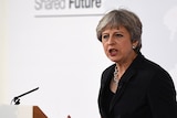 Britain's Prime Minister Theresa May gestures with both hands while speaking in Florence.