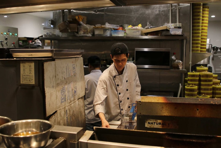 The head chef at work in Emperor's Kitchen.