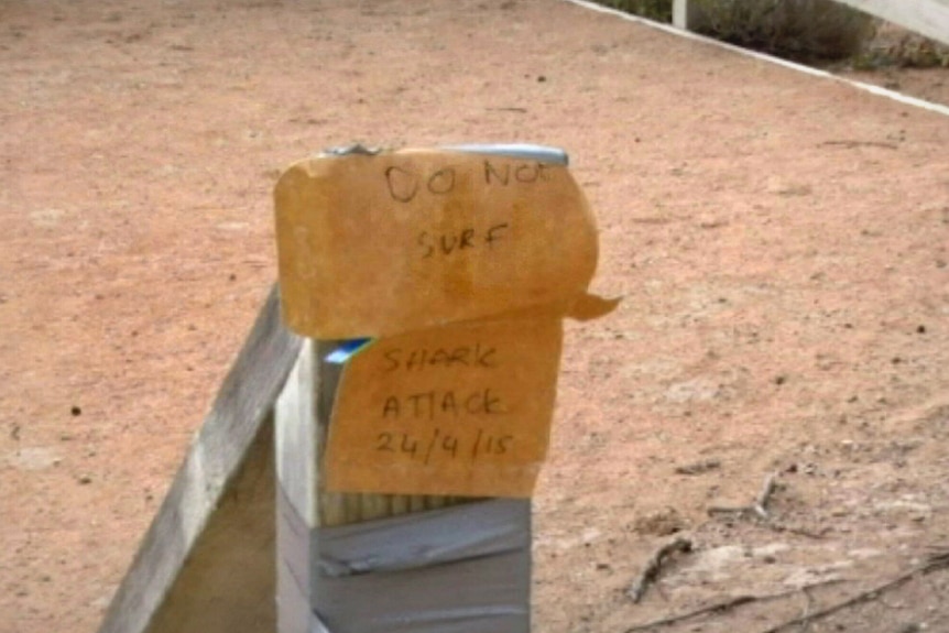 Shark attack sign in Fishery Bay