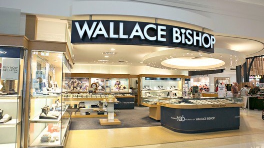 A jewellery store with a sign at the top reading Wallace Bishop 