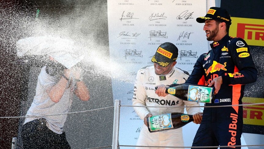 Daniel Ricciardo celebrates on the podium at the Spanish Grand Prix
