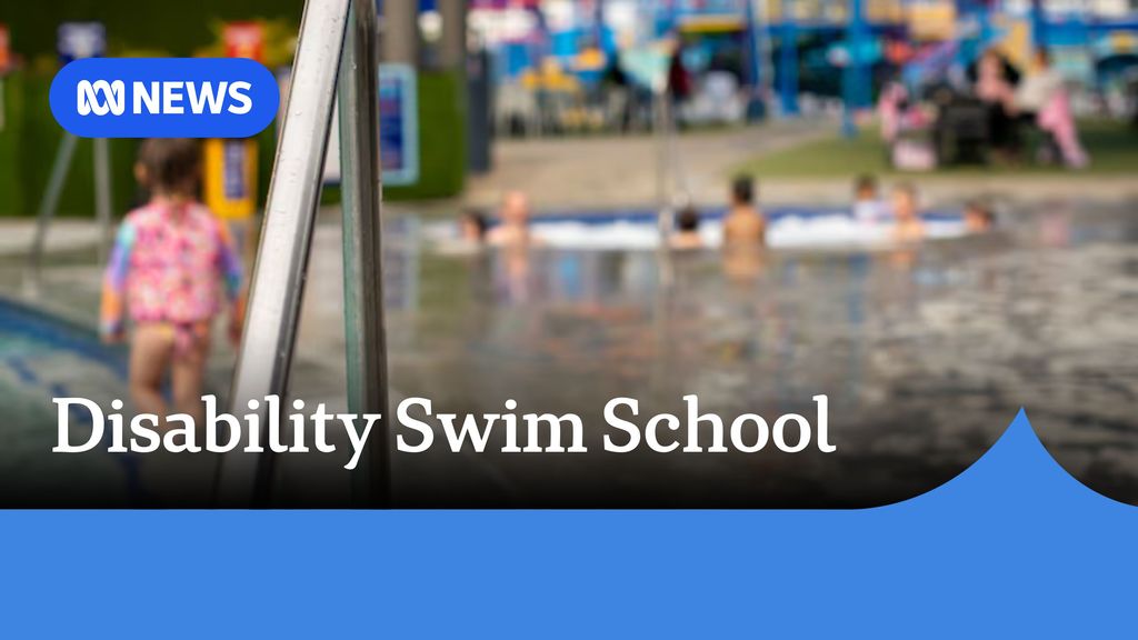 Disability Swim School: A swimming poool with people out-of-focus swimming.