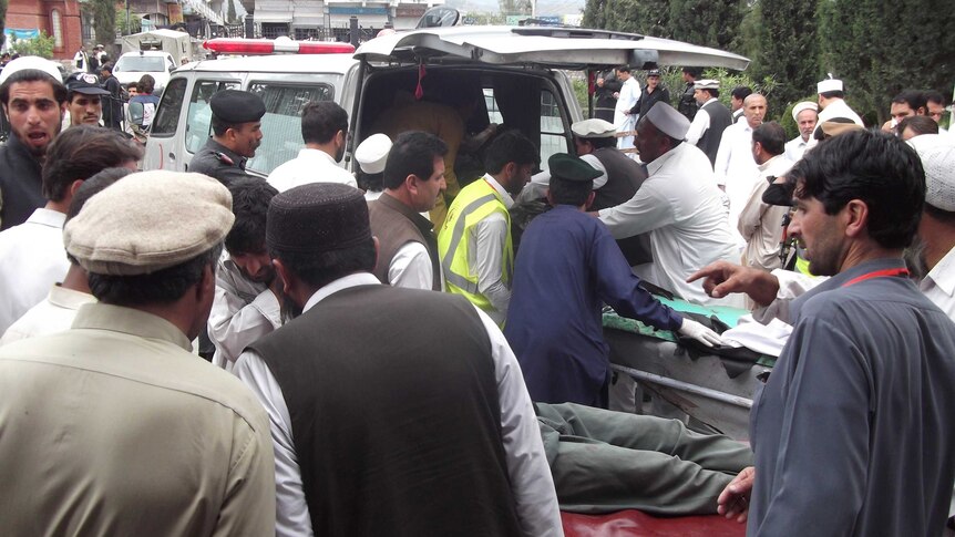 Death toll from twin suicide attacks in Pakistan rises