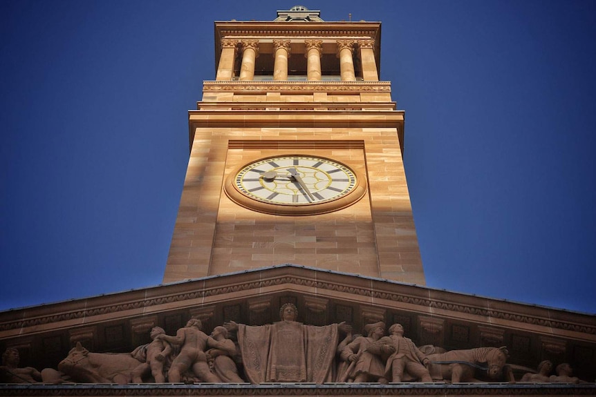 Brisbane City Hall clock tower looking up towards the sky.