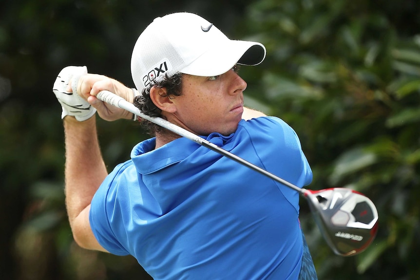On the prowl ... Rory McIlroy makes his tee shot to open his final round
