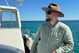 John Cecchi on his boat off the coast of Perth.