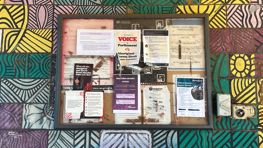 A community noticeboard with a flyer about the Voice. 
