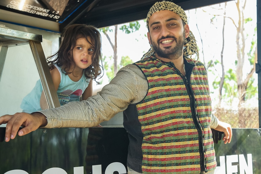 Nadeem Turkia at his family's food truck with his sister