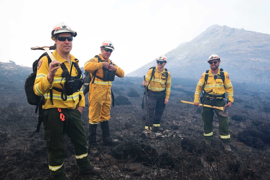 Crew in park fighting fire.