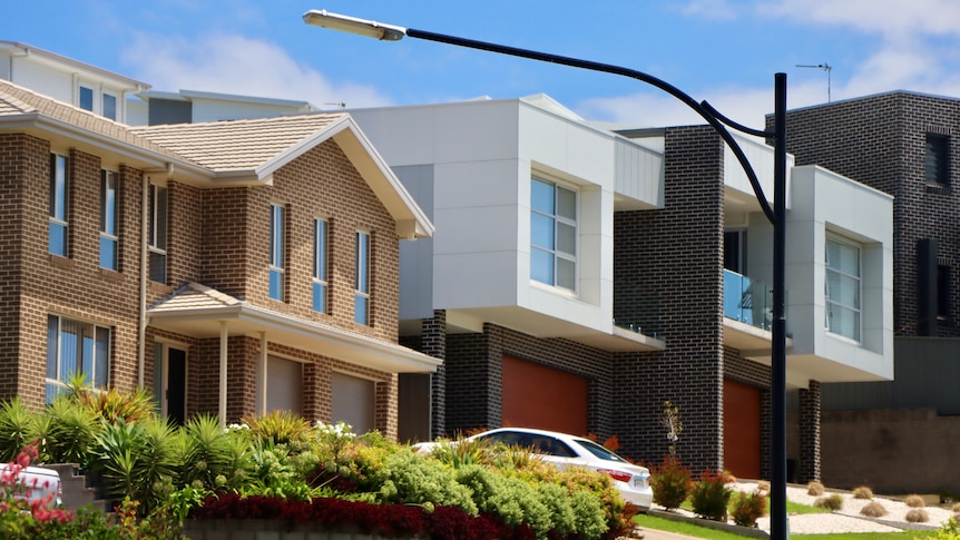 A row of modern-looking townhouses.