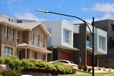 A row of modern-looking townhouses.