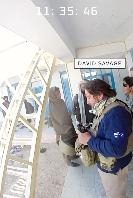 David Savage with soldiers at the compound.