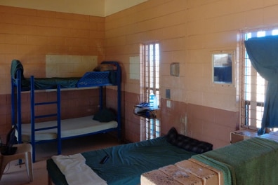 Interior of a cell in Roebourne Regional prison showing several beds.