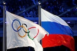 The Olympic and Russian flags fly together