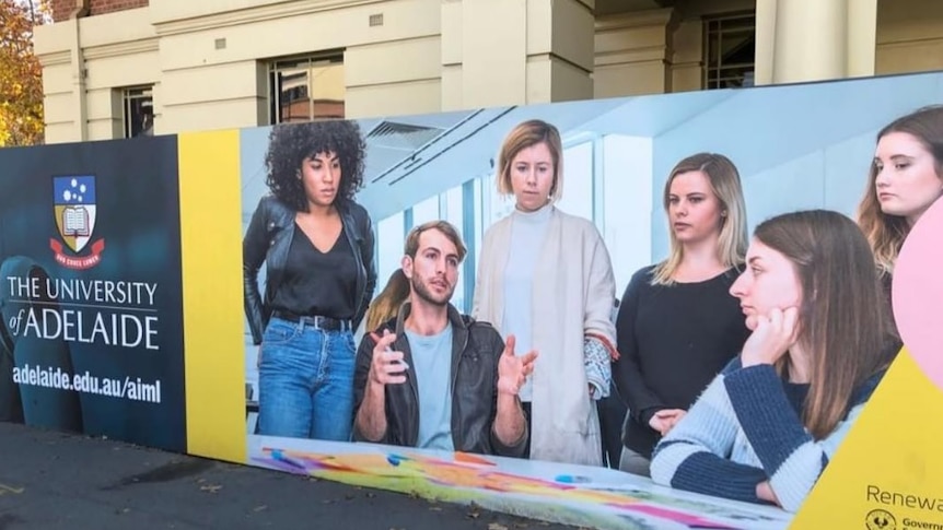 An ad showing a young man surrounded by young women.