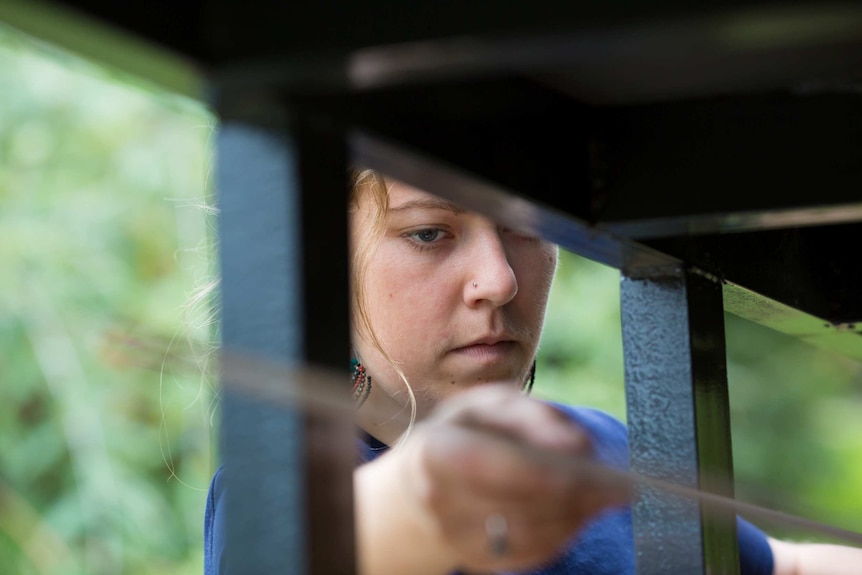 Sarah Smethurst works on her tiny house.