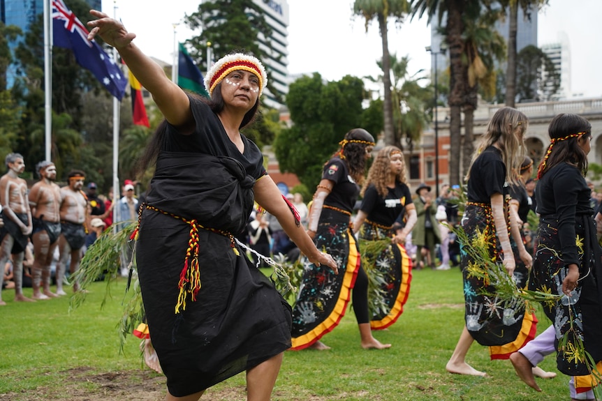 An Aboriginal woman performing a traditional dance