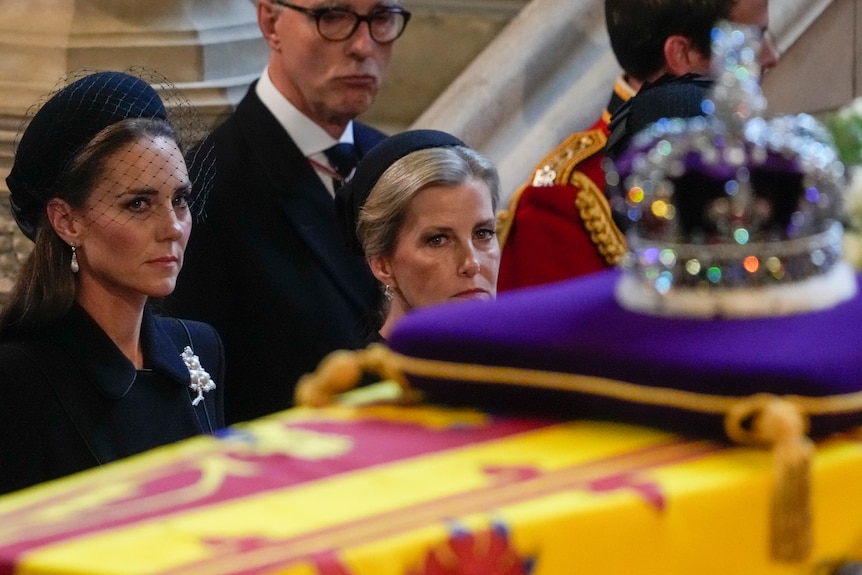 Princess Kate looks up at Queen Elizabeth II's coffin. 
