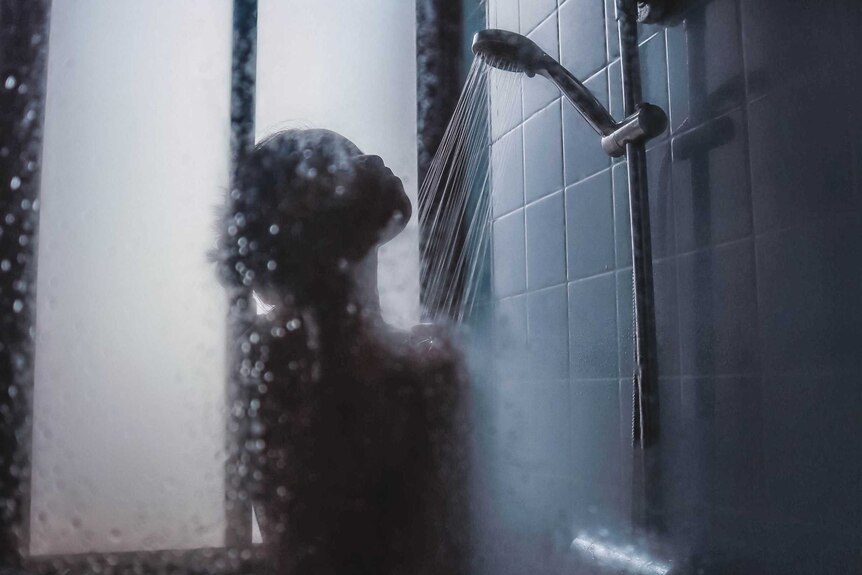 Shadow of woman showering