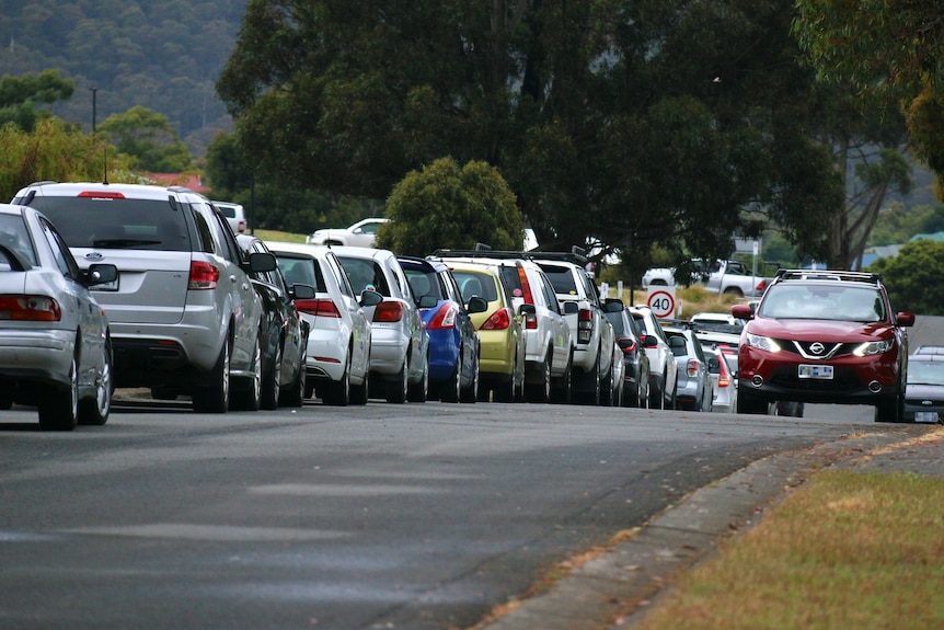 Cars line up at Kingborough Sports Centre COVID testing clinic