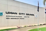 A building with sign 'Logan City Council Administration Centre 150 Wembley Road' written on it