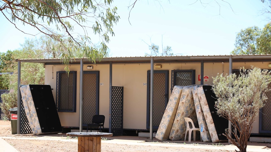 Mattresses stacked outside rooms where gastro outbreak has occurred.