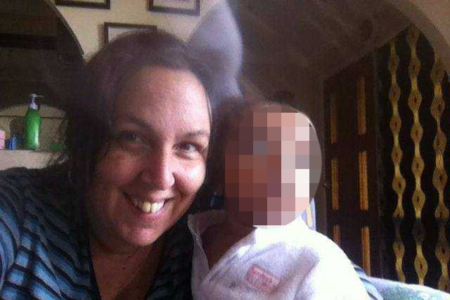 A photo shows Jennifer Downes smiling with one of her children, the child's face blurred.