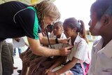 Dr Josh Francis examines children at a school in the regional district of Emera in East Timor.