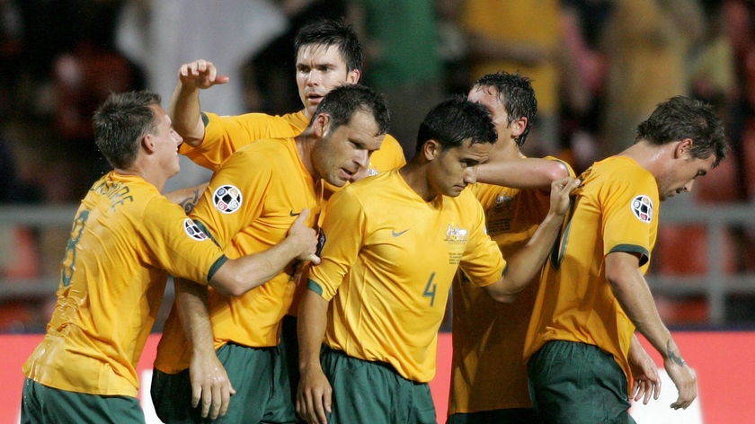 Socceroos players celebrate