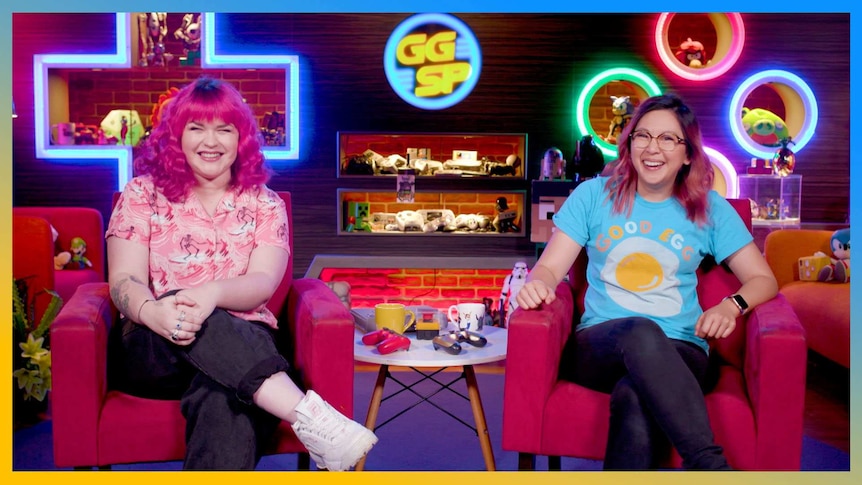 Gem and Rad sit in their red couches on the GGSP studio and smile at the camera
