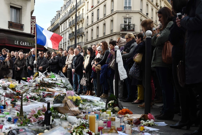 People observe a minute of silence in Paris