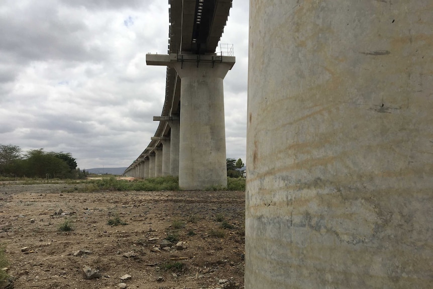 The railway line build above thick concrete pillars
