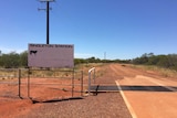 An outback sign saying Singleton Station