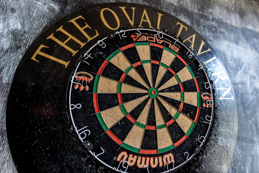 A dart board with 'The Oval Tavern'