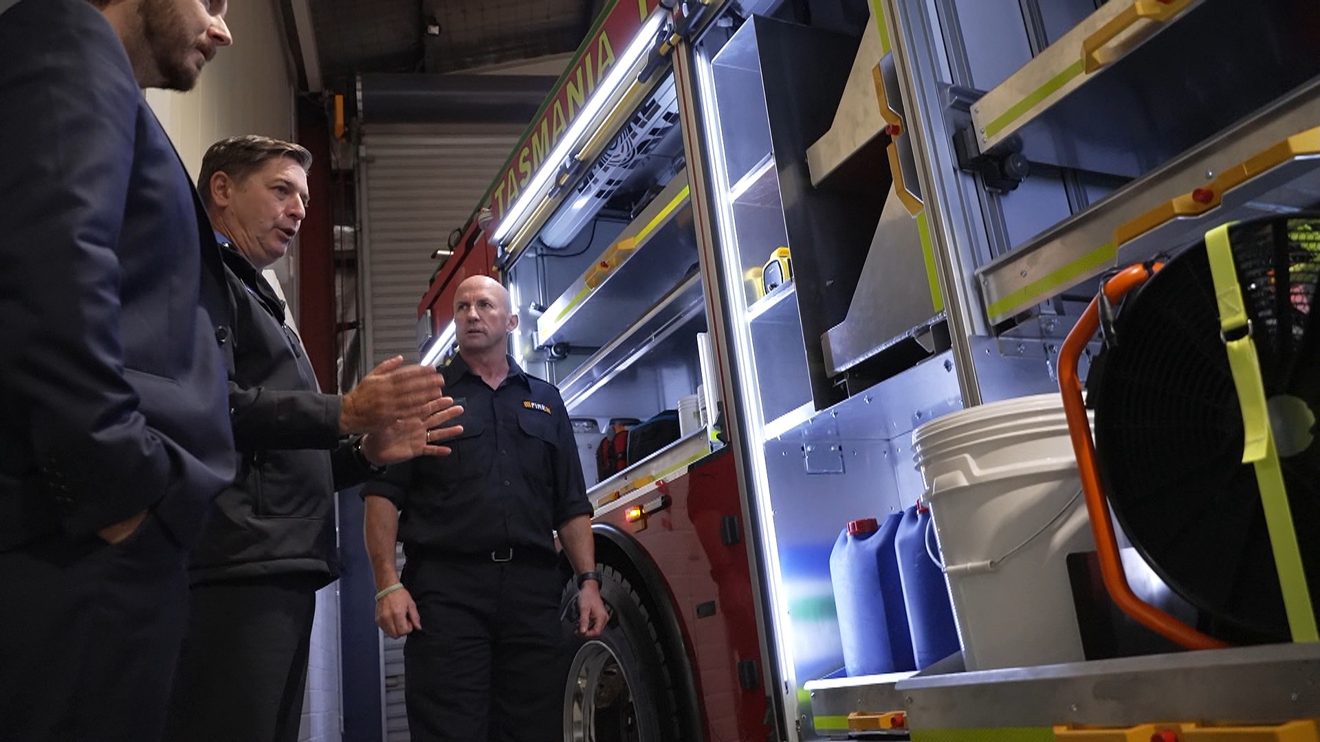 new Tasmanian fire truck in shed being inspected