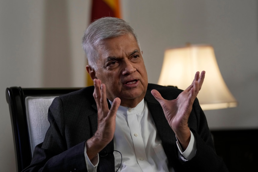 Sri Lanka's new prime minister Ranil Wickremesinghe gestures during an interview