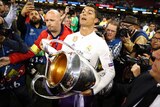 Real Madrid's Cristiano Ronaldo celebrates with the Champions League trophy after beating Juventus in the final.