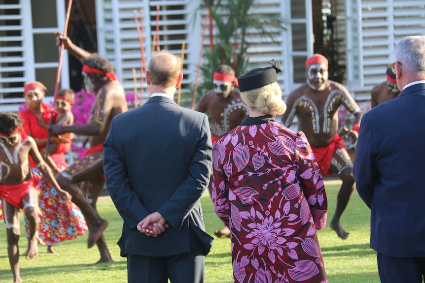 Prince Edward and Vicki O'Halloran watch on as a group of seven Larrakia Nation dancers perform in front of Government House.